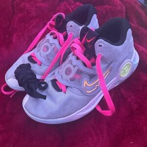 Nike Athletic Shoes with Pink and Black Accents